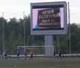 Big LED screen on a small football pitch